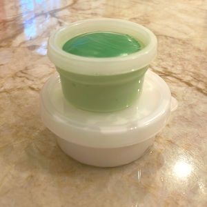 Green christmas themed slime with clay and charms